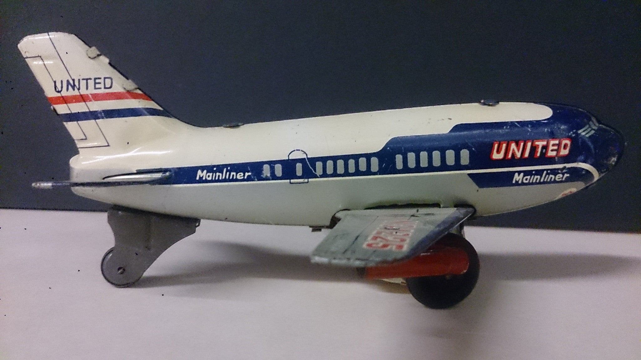 Friction Toy Plane DC-7, United Airlines Mainliner, Tin, Litho