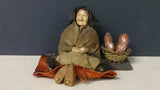 Doll, Hand Made, Older Women Sitting On a Bench With Basket Of Meats - Roadshow Collectibles