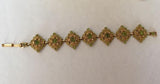 Gold Plated Bracelet, Flower Design, Group Of Green Peridot Gemstones - Roadshow Collectibles